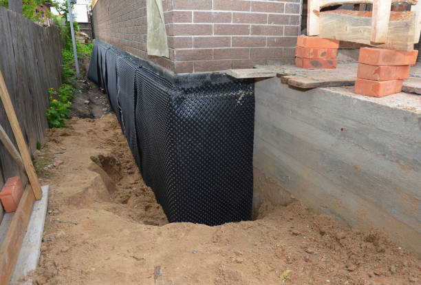 Happy homeowners after waterproofing job in Oxford